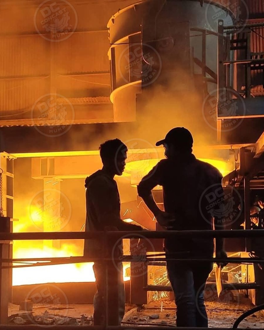 Two operators watching the furnace during a heat